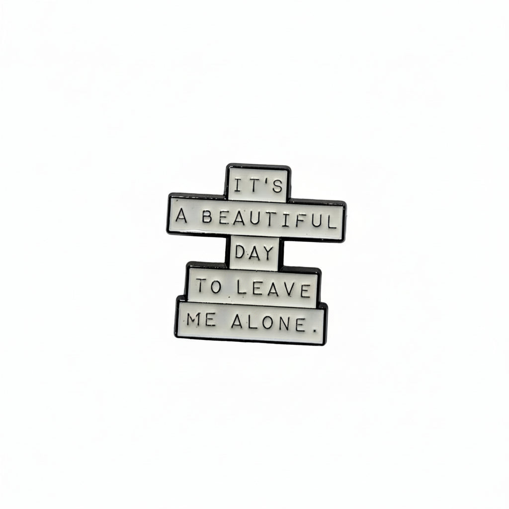 it's a beautiful day to leave me alone enamel pin featuring black and white text design, style gift for jackets and bags