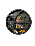 Round decorative shelf with various small items on a white wall