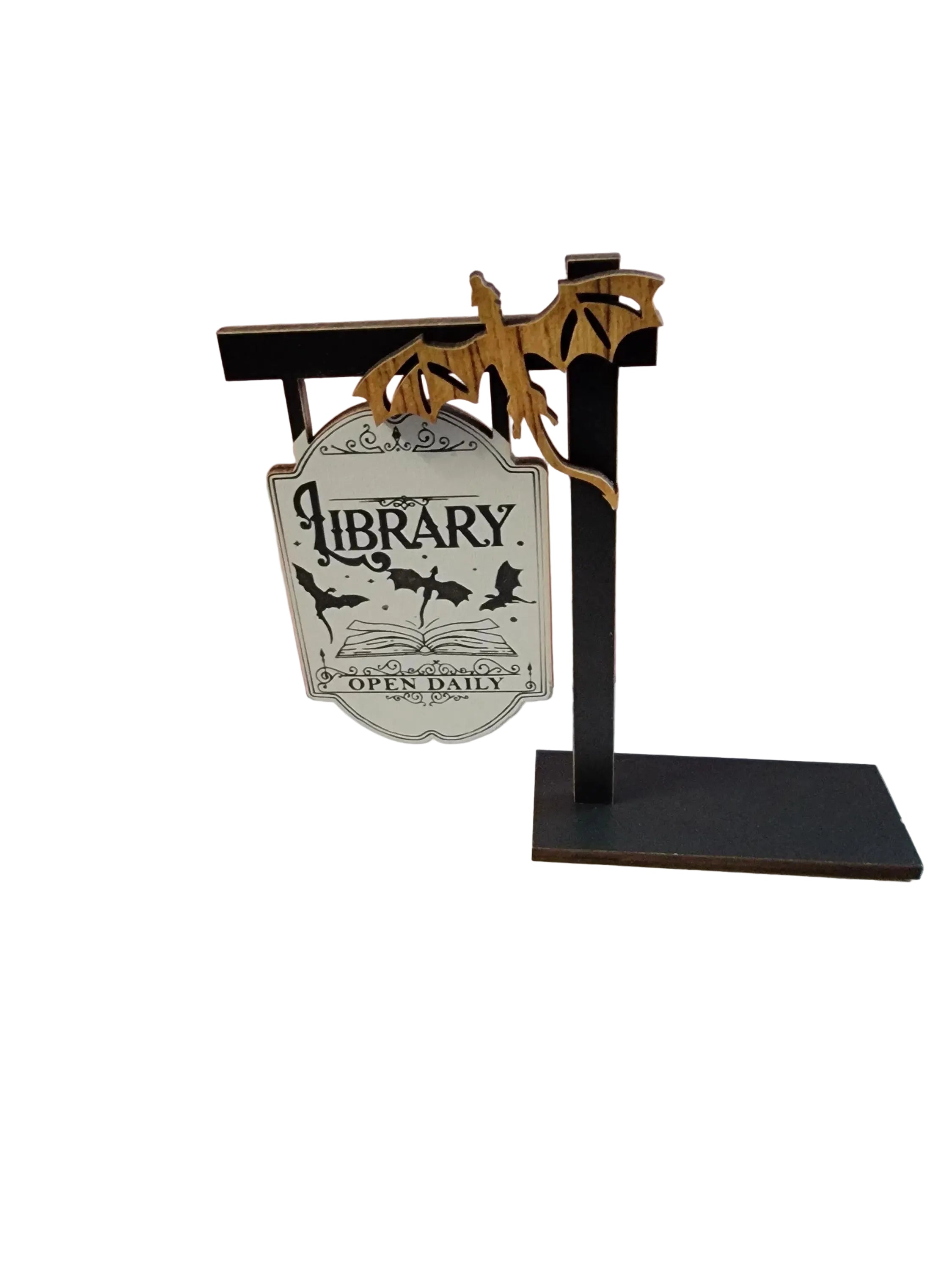 Decorative sign on a stand with 'Library Open Daily' text against a gradient background