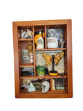 Wooden shelf with various decorative items against a white wall