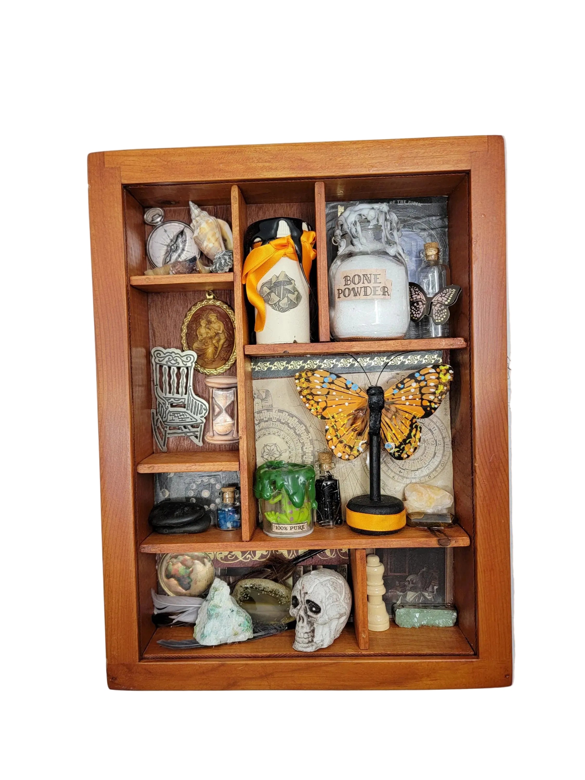 Wooden shelf with various decorative items against a white wall