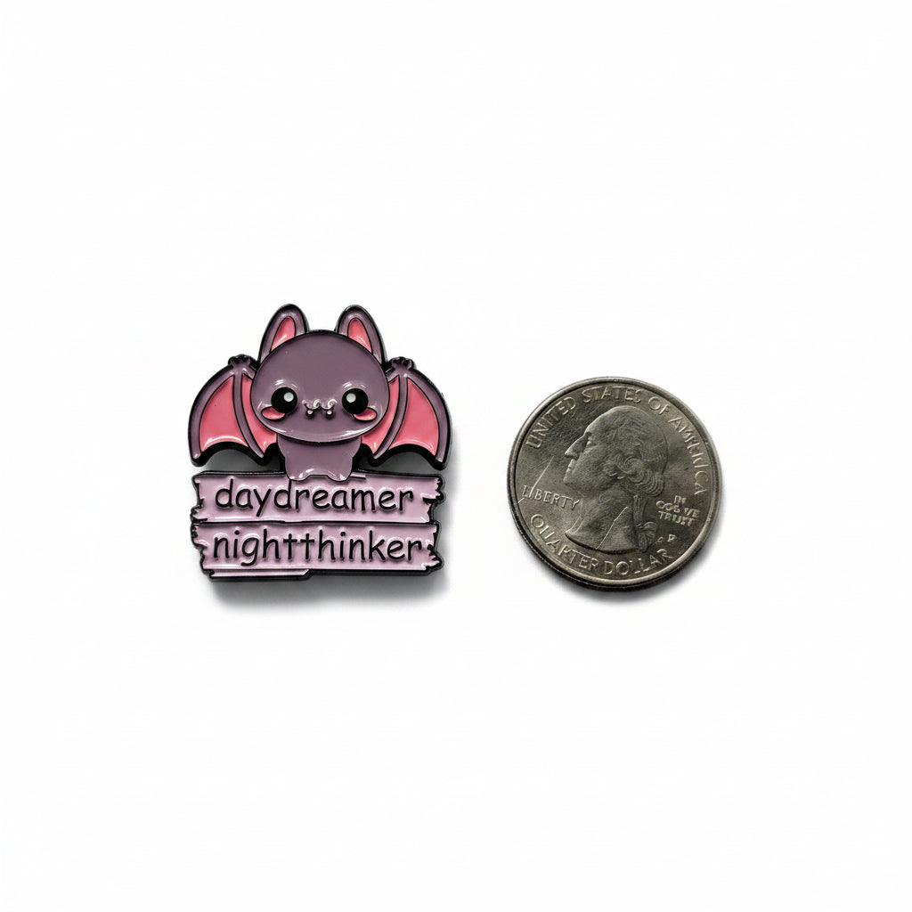 day dreamer night thinker enamel pin shown next to quarter for size reference witch enamel pin 1 1/8 in W x 1 1/8 in H
