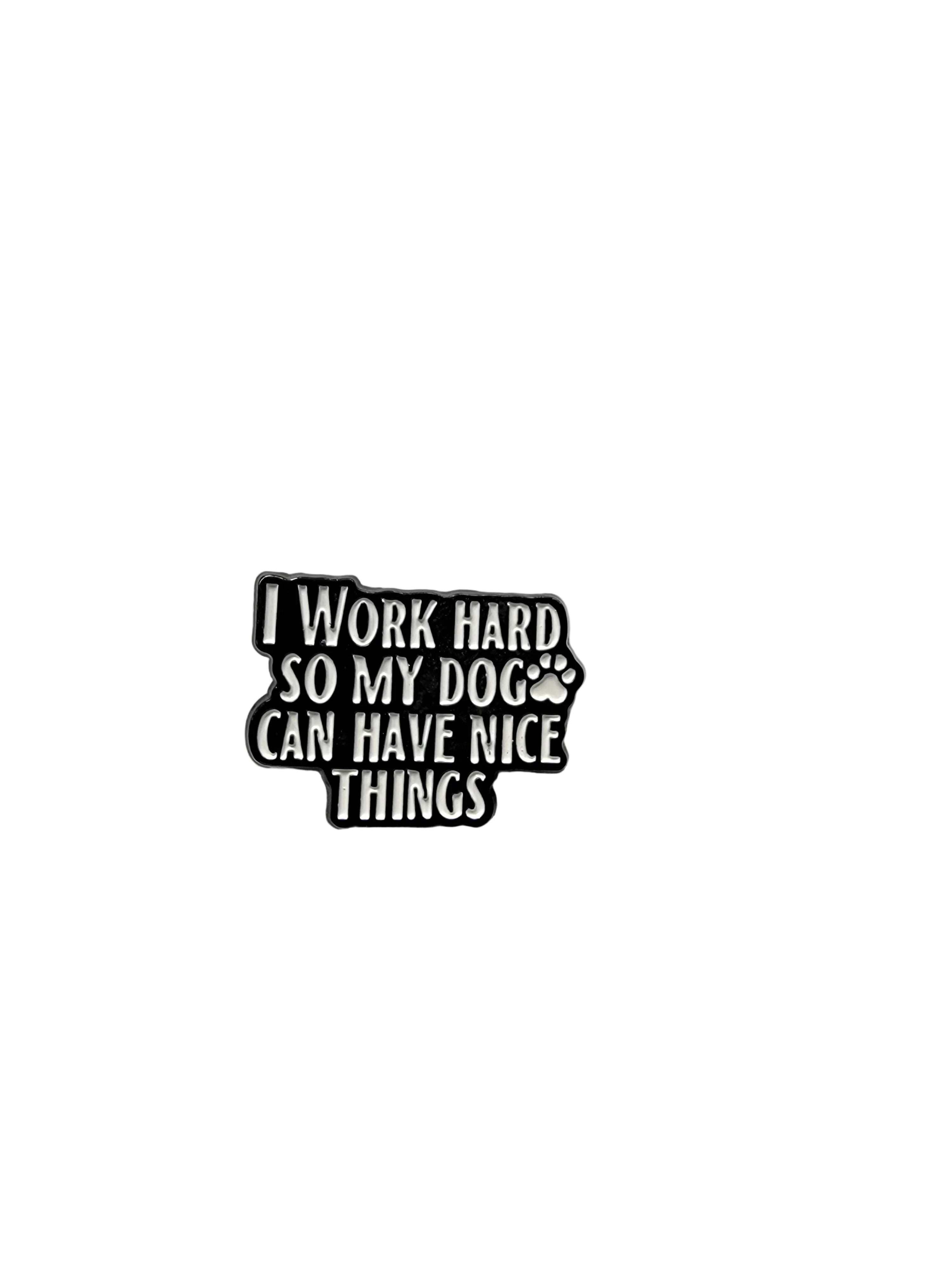 Black and white enamel pin with text on a gray background