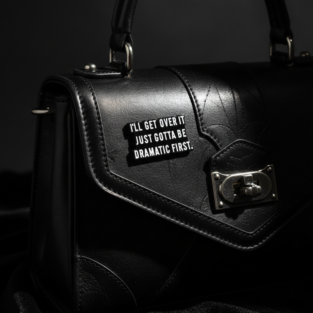 I'll get over it just gotta be dramatic first enamel pin attached to purse gen z brooch accessory for bags and personal style