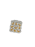 Decorative pin with text and ducks on a white background