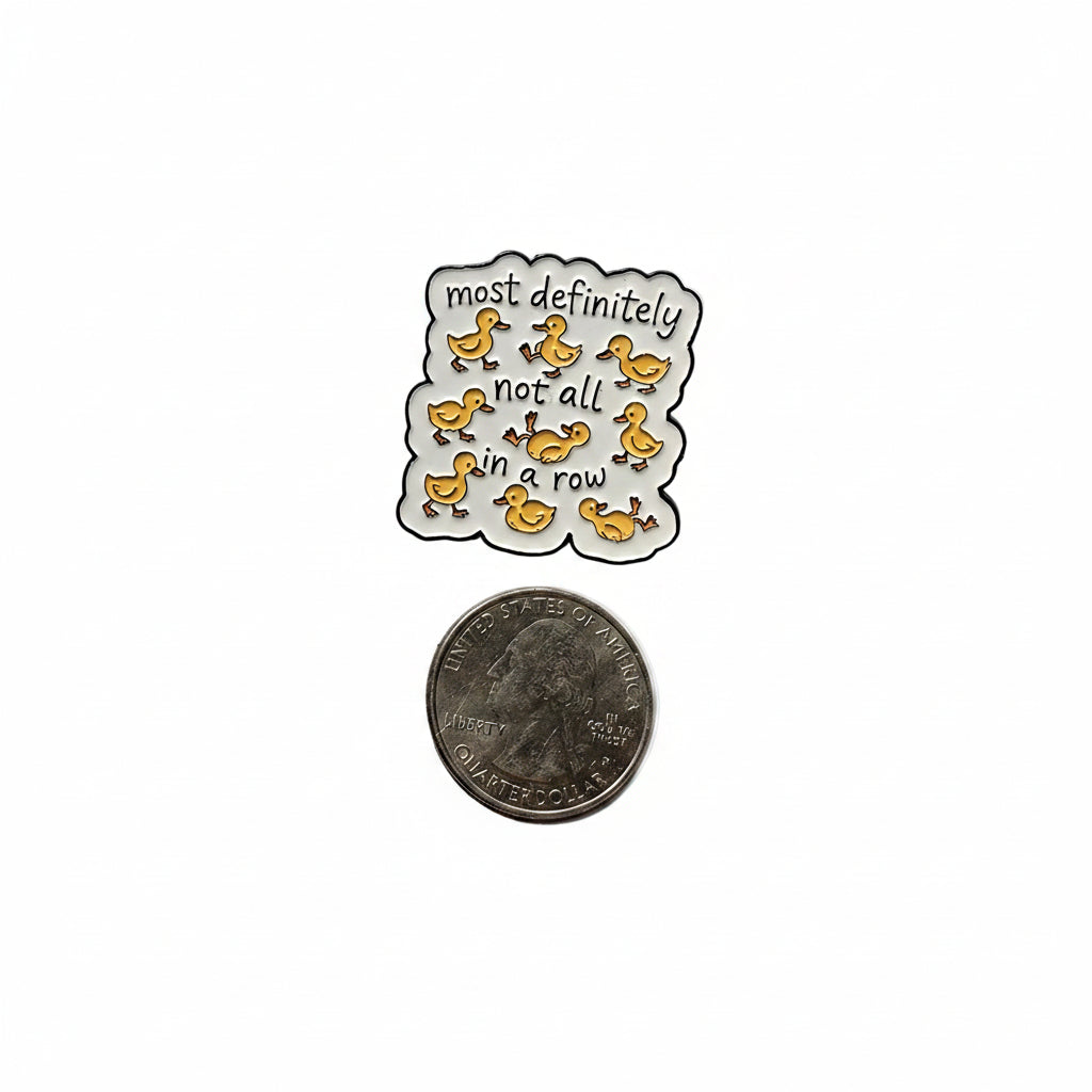 Most definitely not all in a row enamel pin shown next to quarter for size reference enamel pin dims 1 1/8 in W x 1 1/4 in H