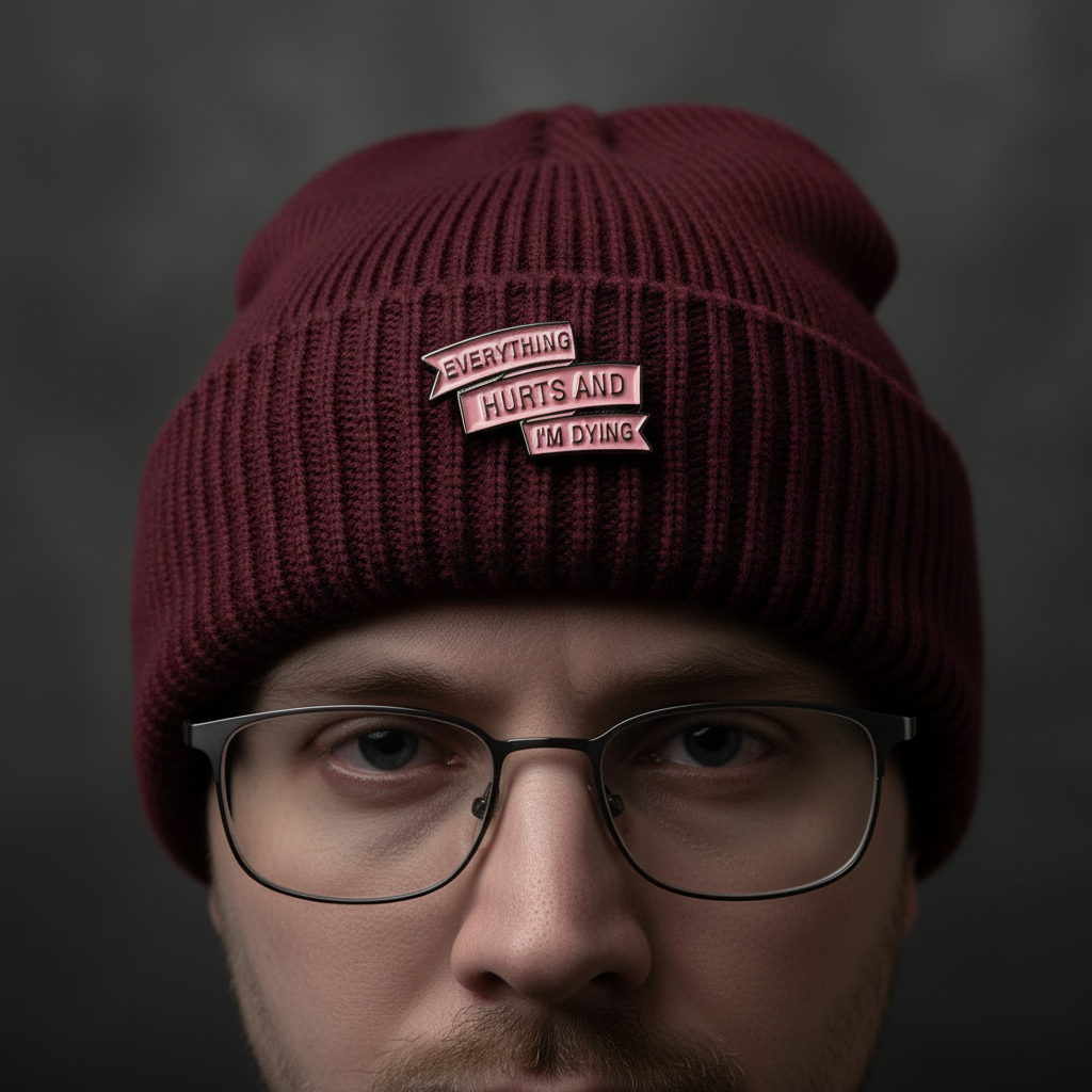 everyting hurts and I'm dying enamel pin worn on beanie hat alternative enamel pin for casual outfits and street wear