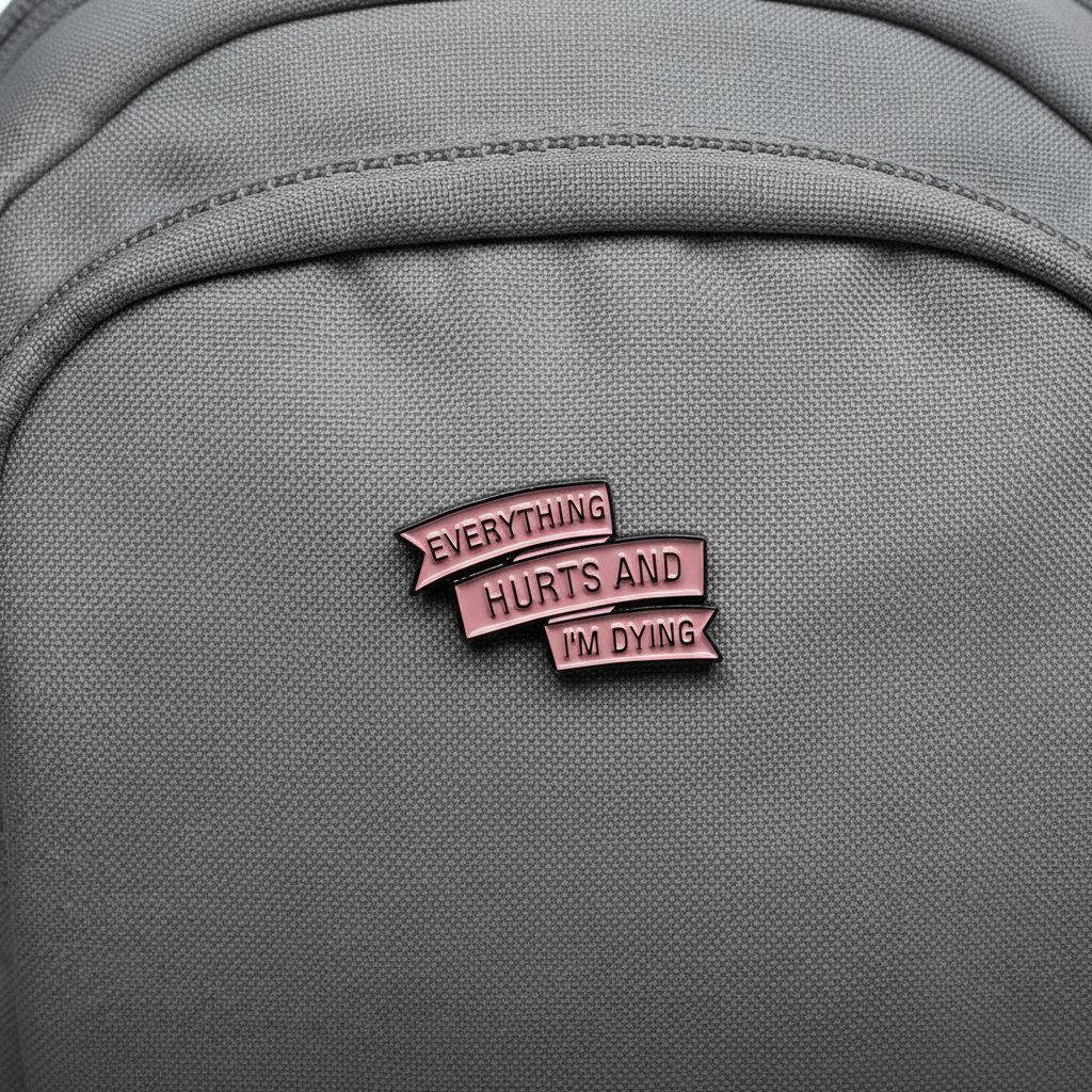 everyting hurts and I'm dying enamel pin on backpack sassy accessory for customizing bags and school gear