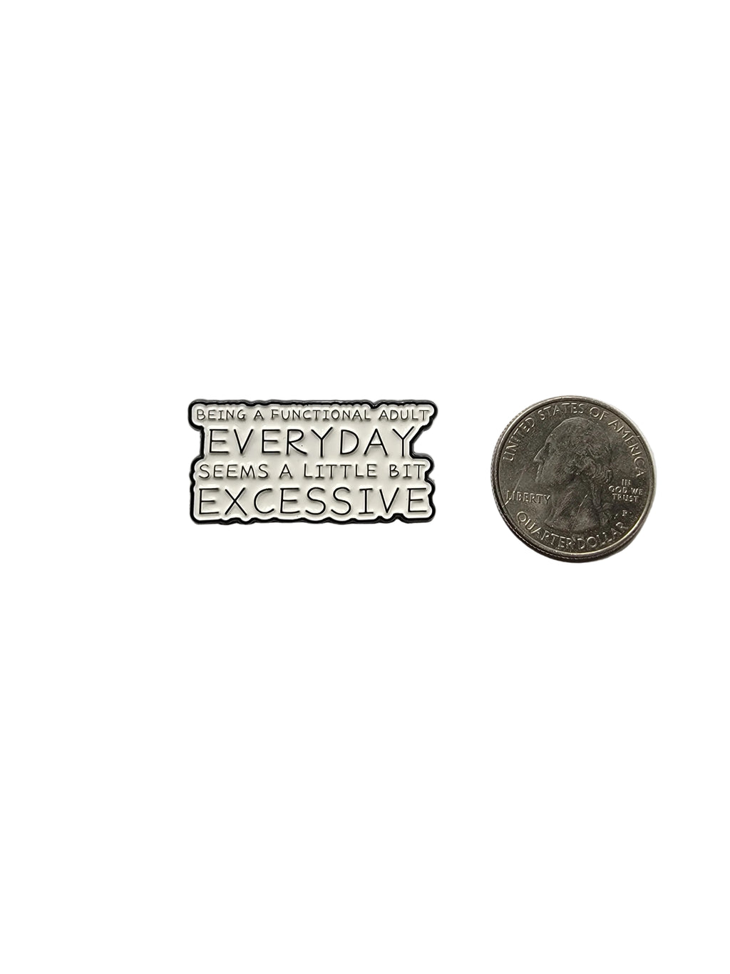 Small metal badge with text on a gray background