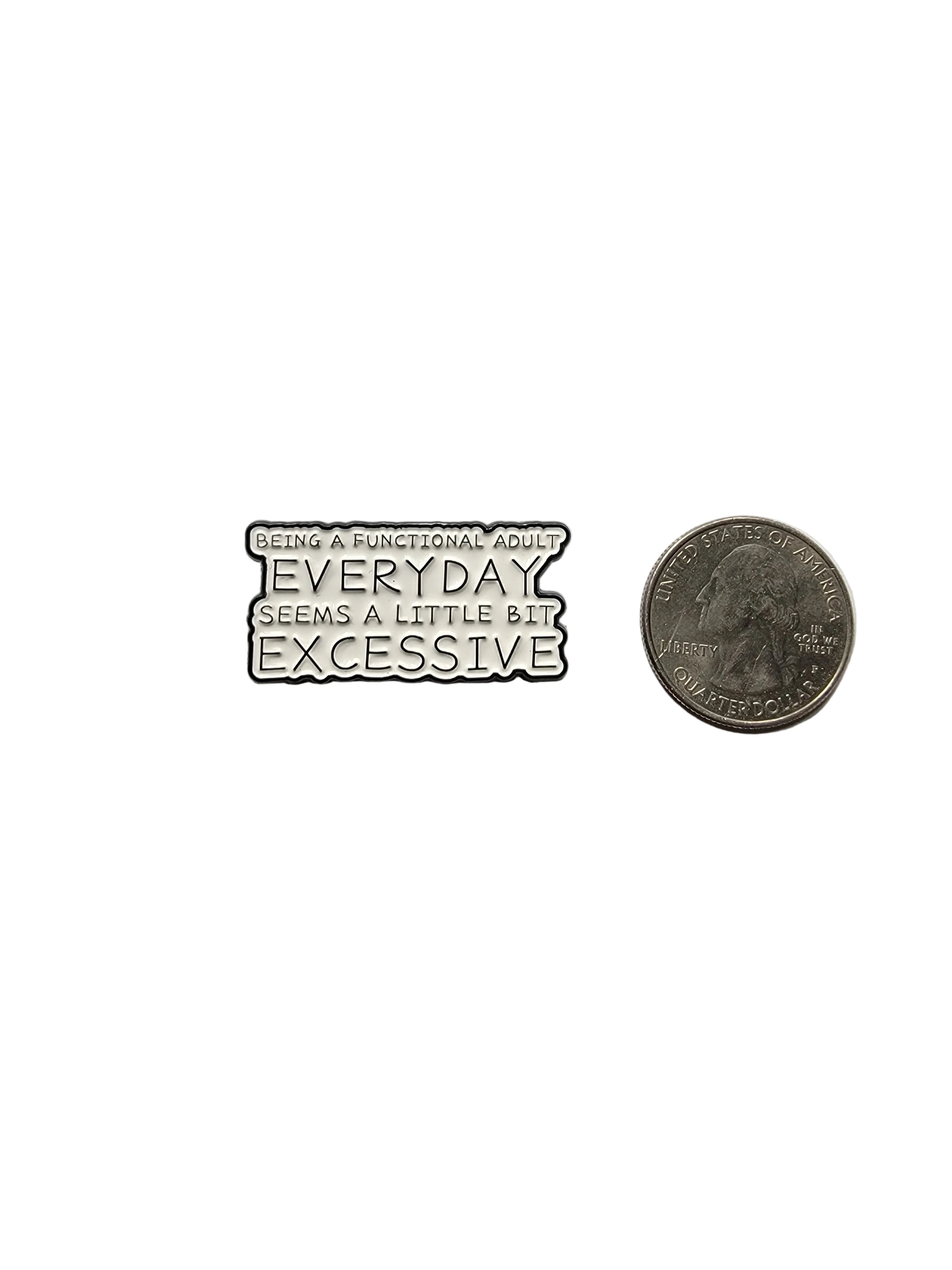 Small metal badge with text on a gray background