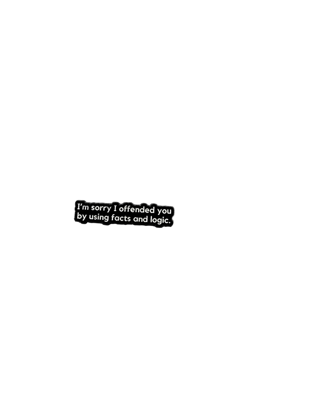 Black enamel pin with white text on white background