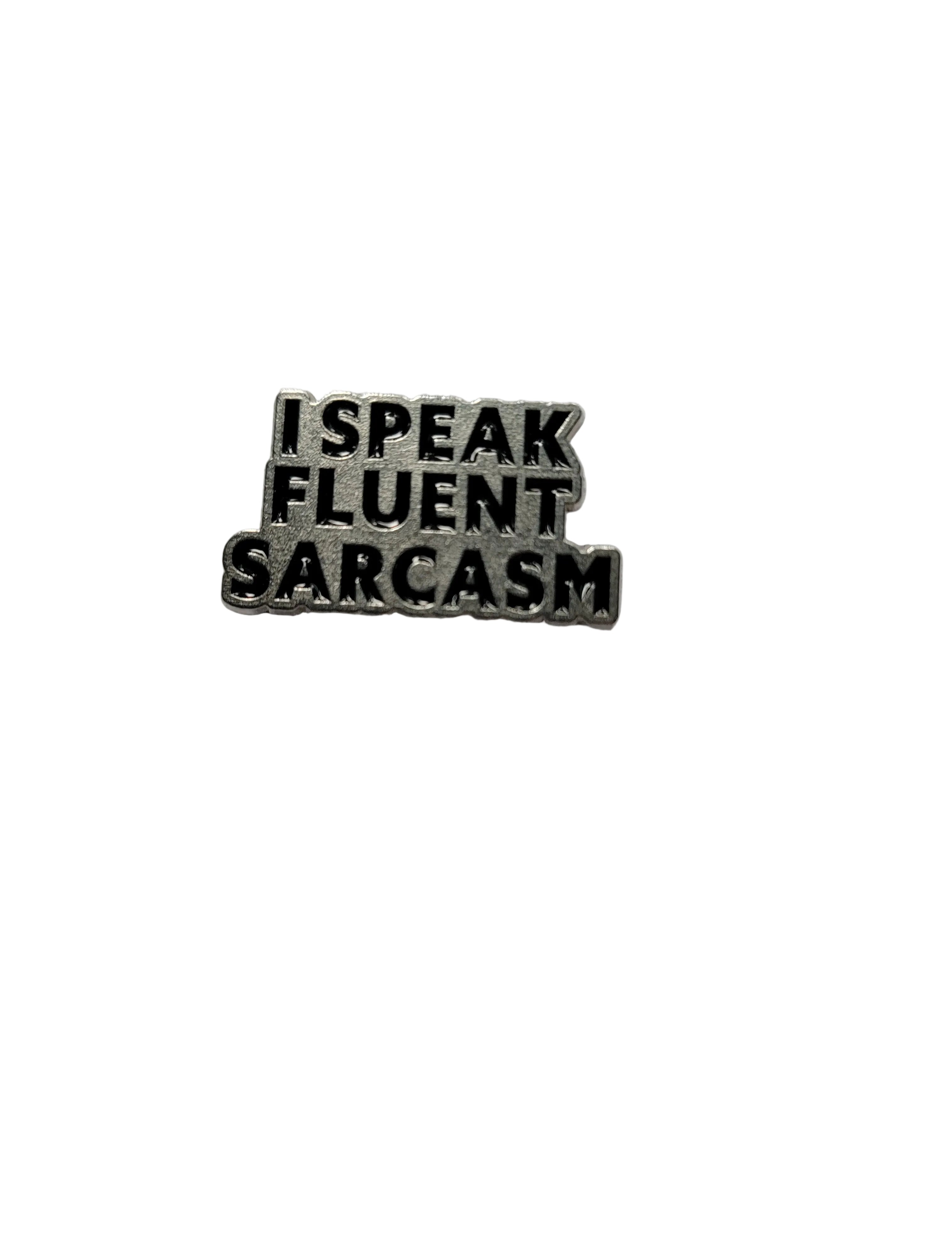 Metallic badge with 'I speak fluent sarcasm' text on a white background
