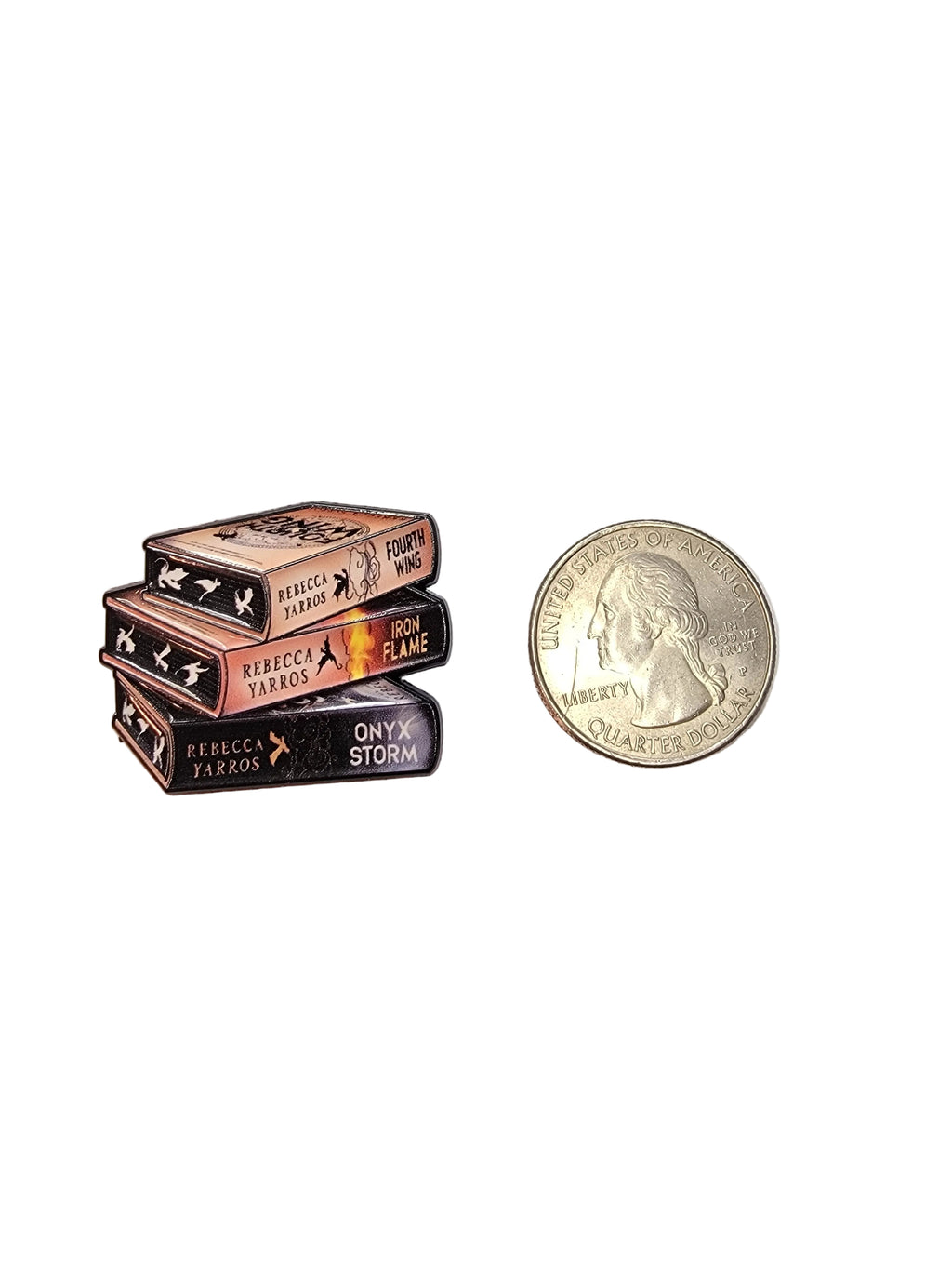 Three small rectangular items with text on a white surface next to a coin.