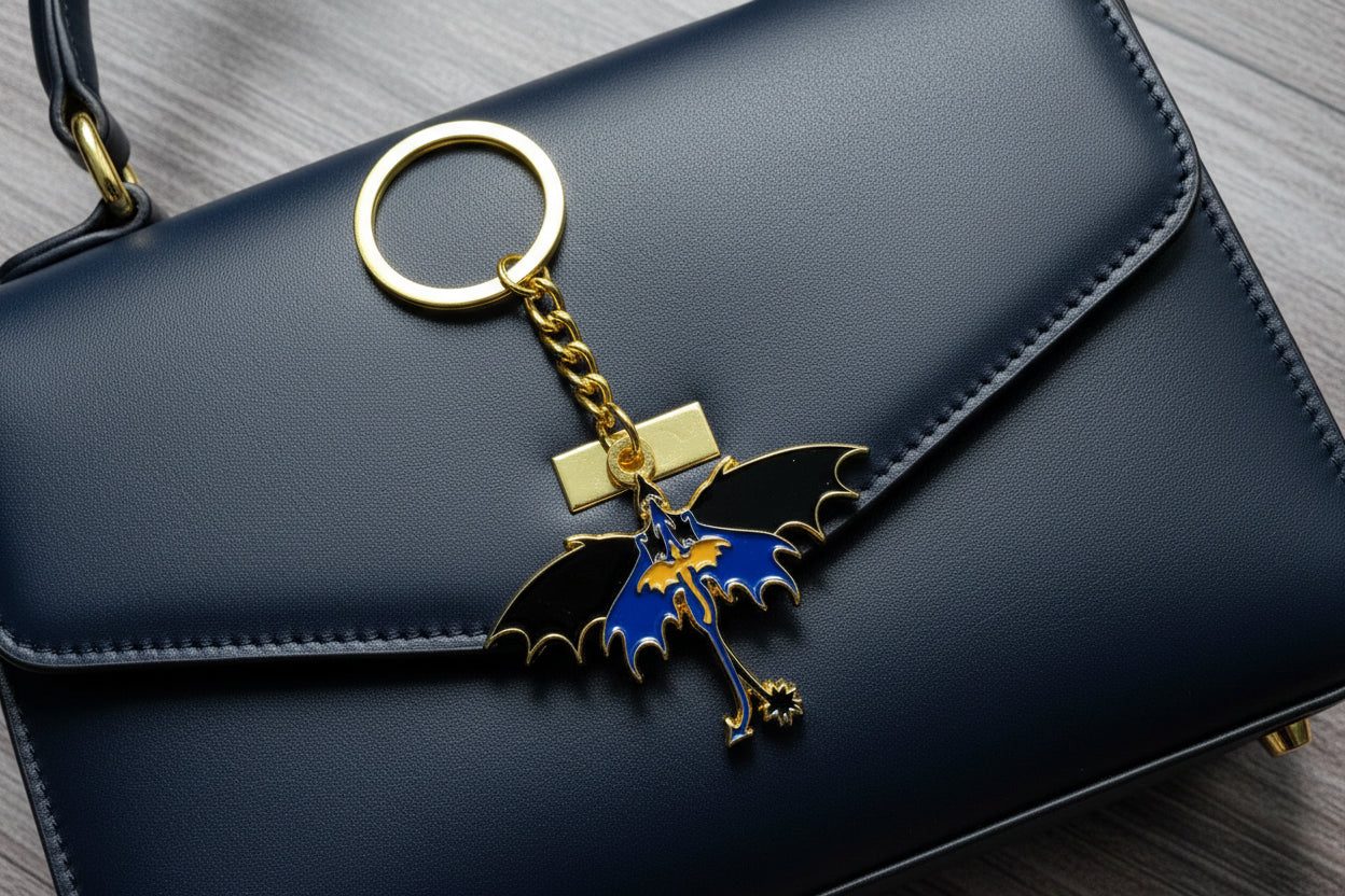 Keychain with a dragon design on a wooden surface