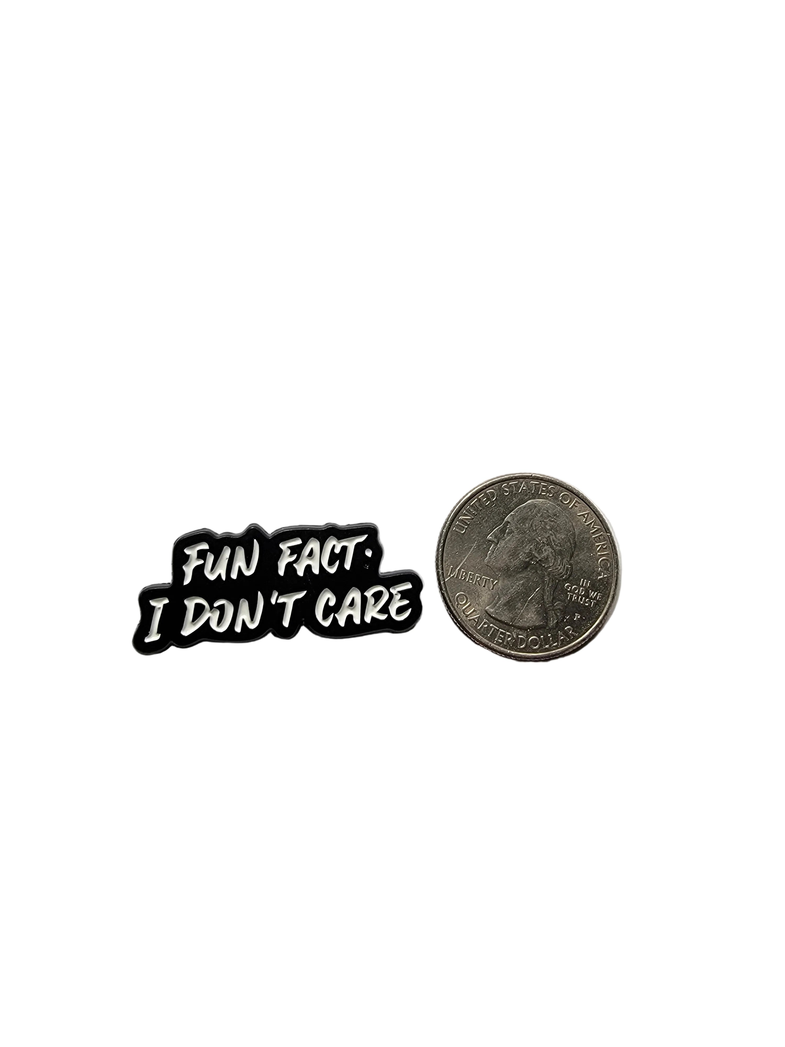 Small black and white enamel pin with 'Fun Fact I Don't Care' text on a white background.