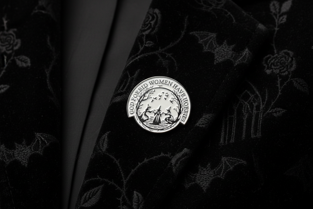 God forbid women have hobbies pin worn on jacket lapel, occult accessory style for gifting