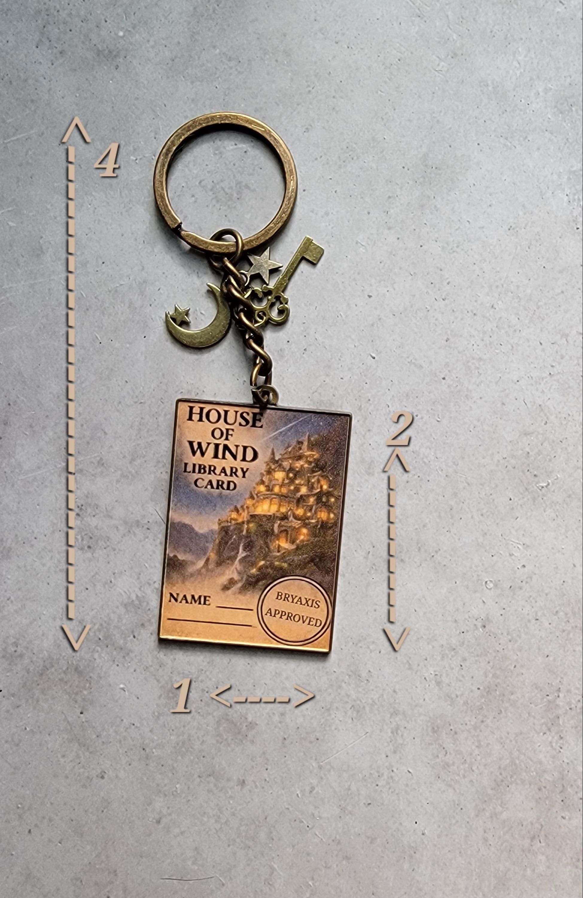 Keychain with a design resembling a library card on a gray surface with measurement indicators.