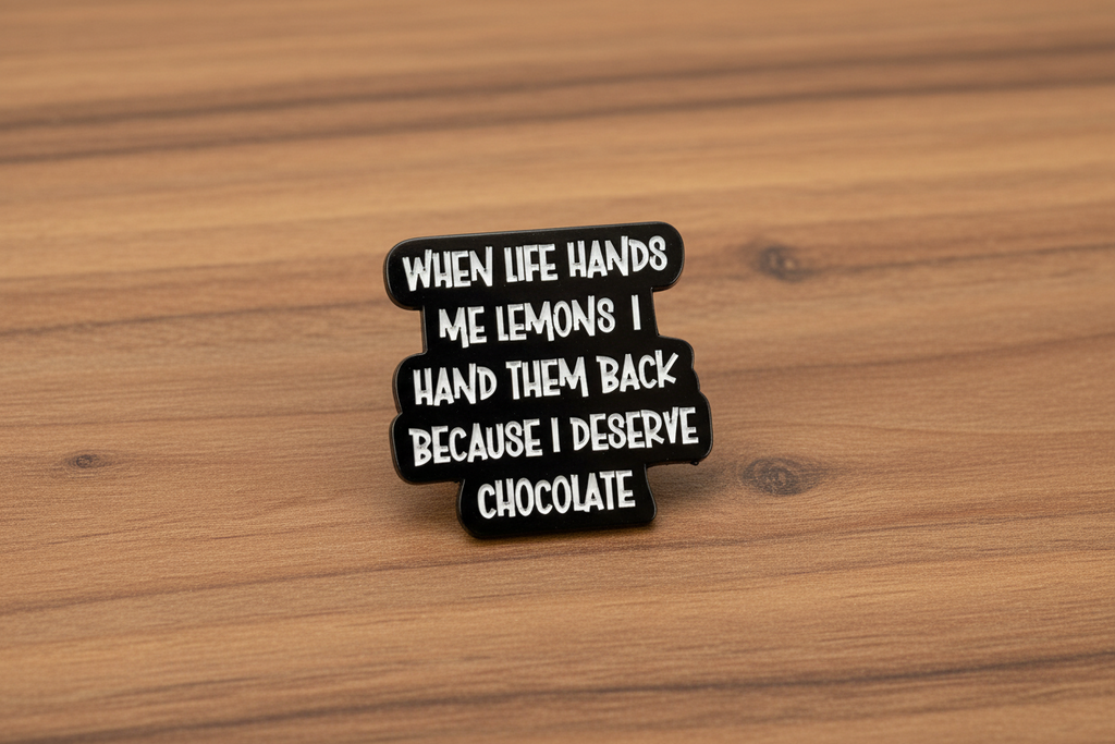 a black pin with white text with a funny quote on a wood background