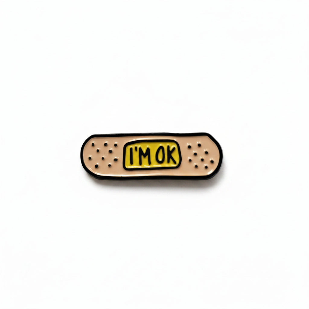 I'm Okay enamel pin featuring bandage design, mental health awaremess gift for jackets and bags