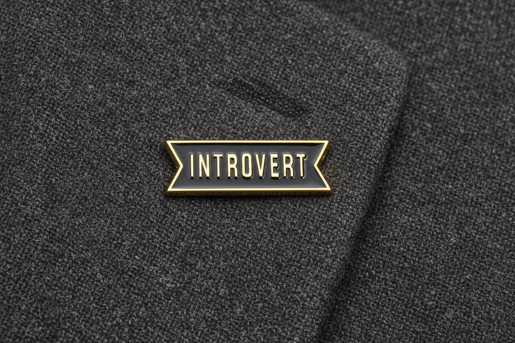Pin with 'Introvert' text on alapel