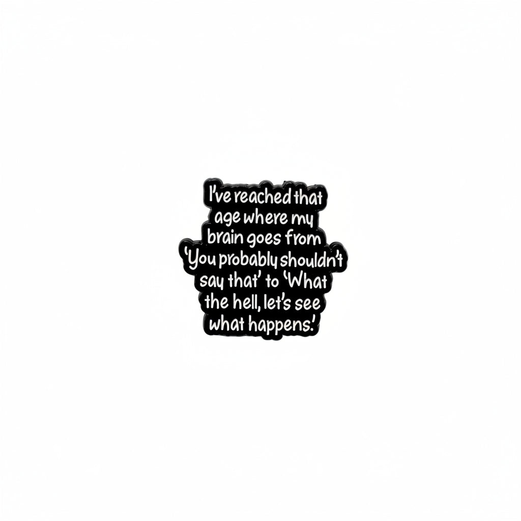Black metal badge with text on a gray background