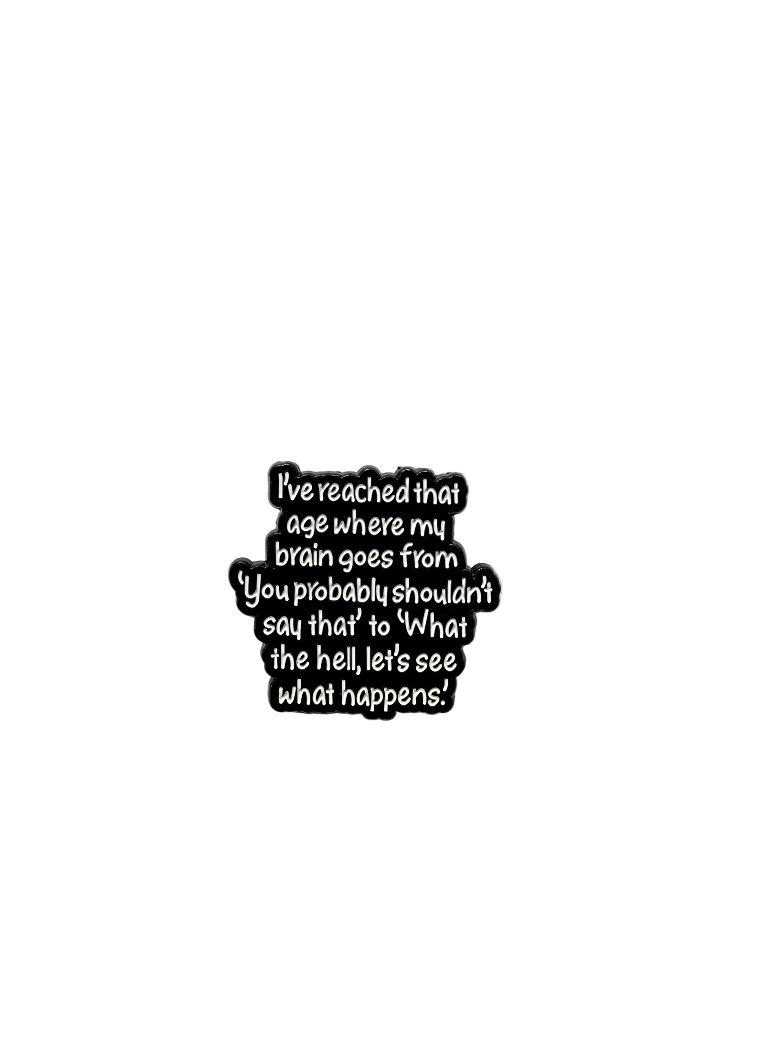 Black metal badge with text on a gray background