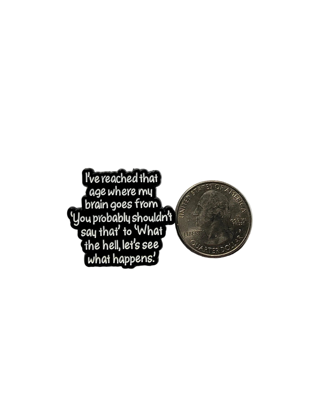Black metal badge with text on a white background
