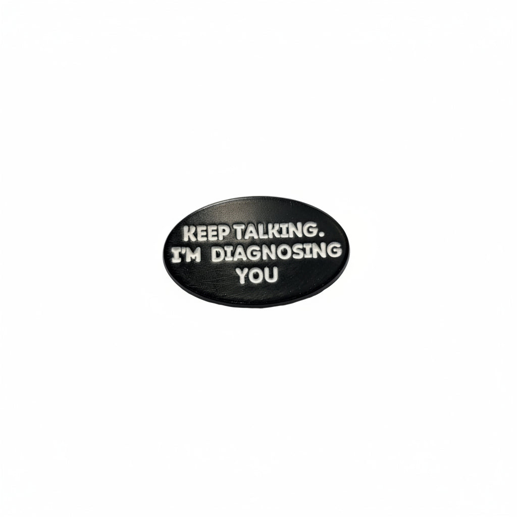 Keep talking. I'm diagnosing you enamel pin featuring black and white text design, funny gift for jackets and bags