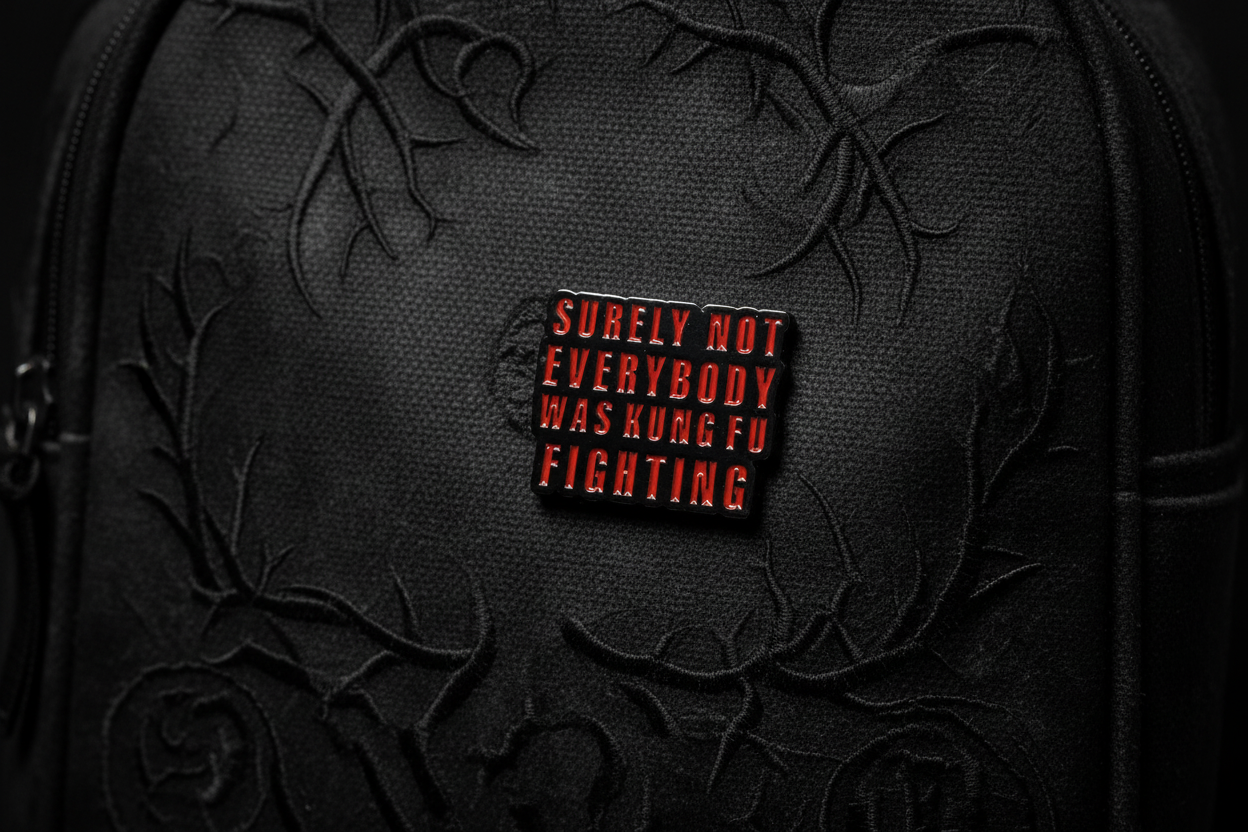 Small rectangular object with text on a black bookbag background