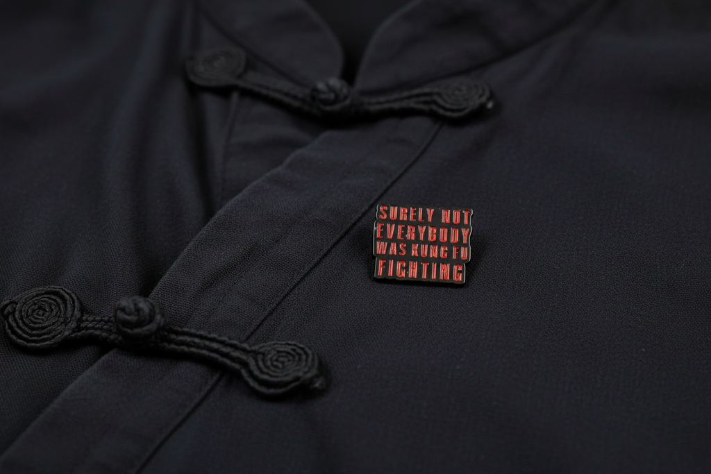 Small rectangular object with text on a black fabric background