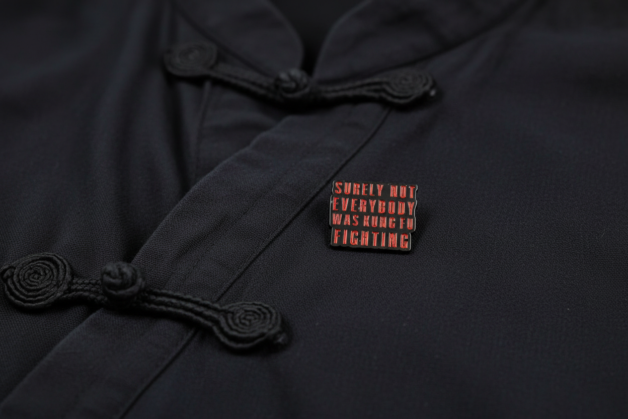 Small rectangular object with text on a black fabric background