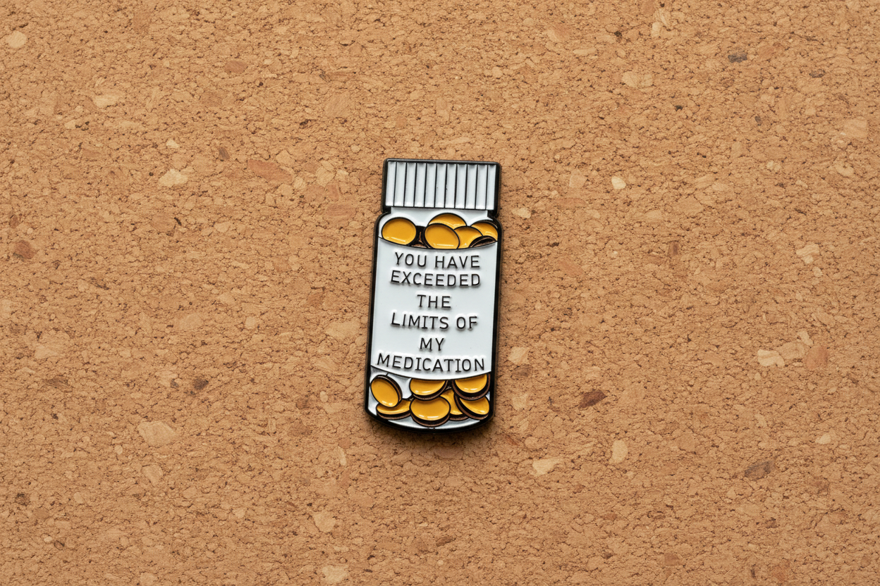 medicine bottle pin with text on a cork background