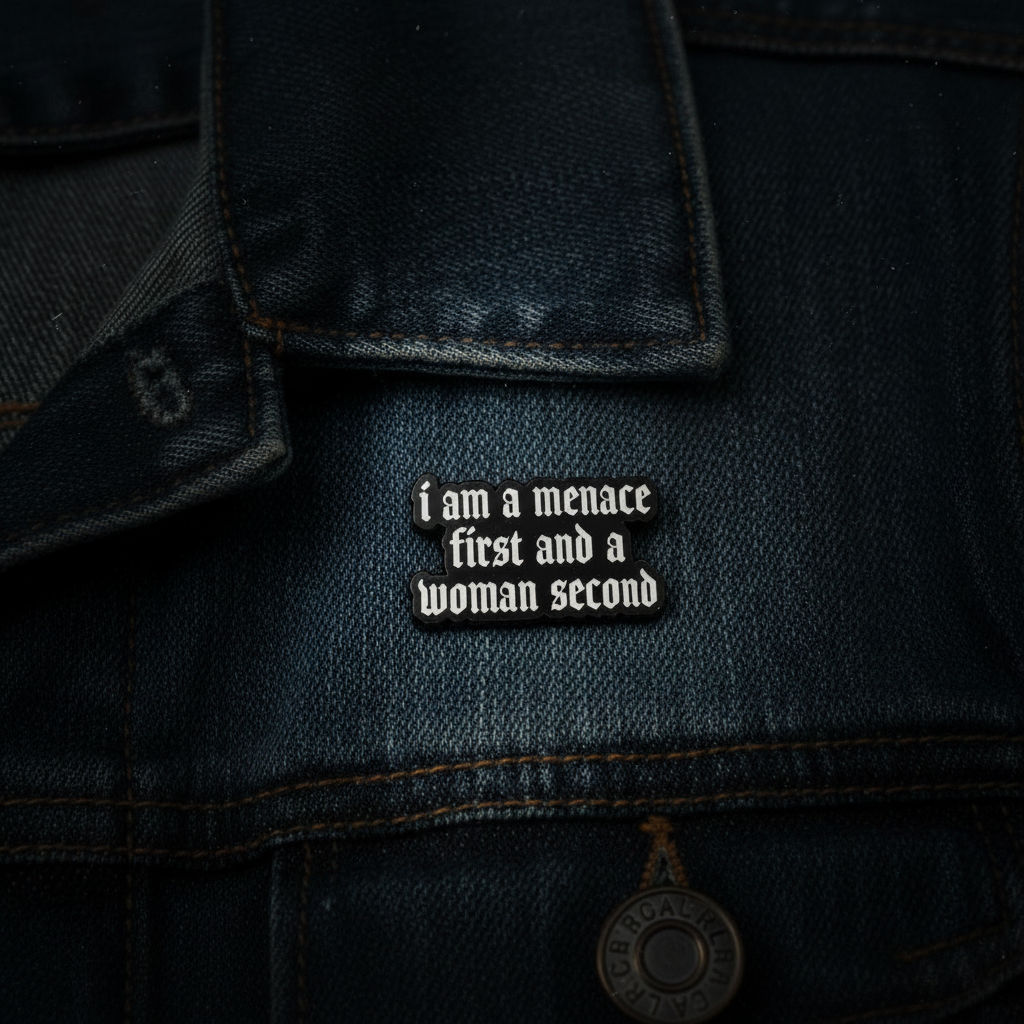 I am a menace first enamel pin worn on jacket lapel, sarcastic pin style for everyday wear