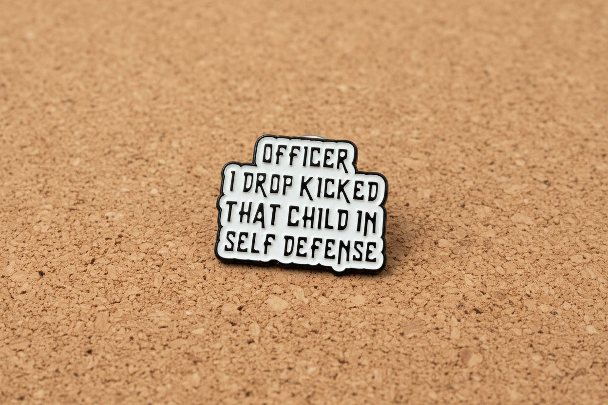 Metallic badge with text on a gray background
