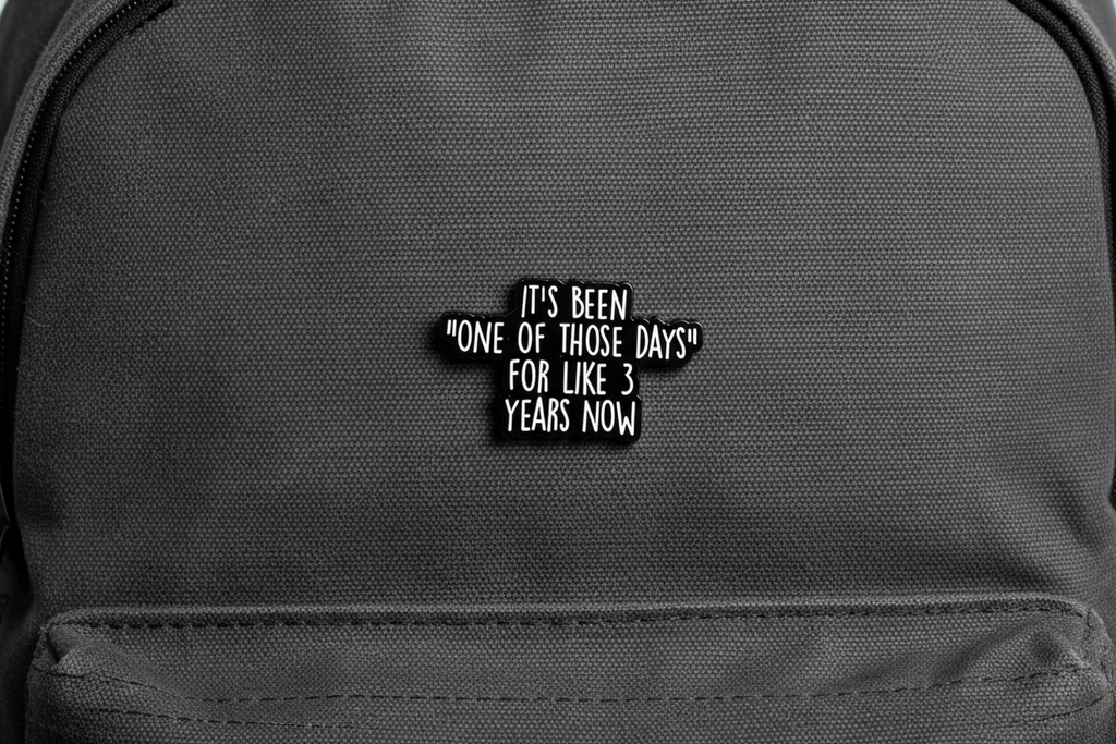 Black text on a gray bookbag background with a humorous quote.
