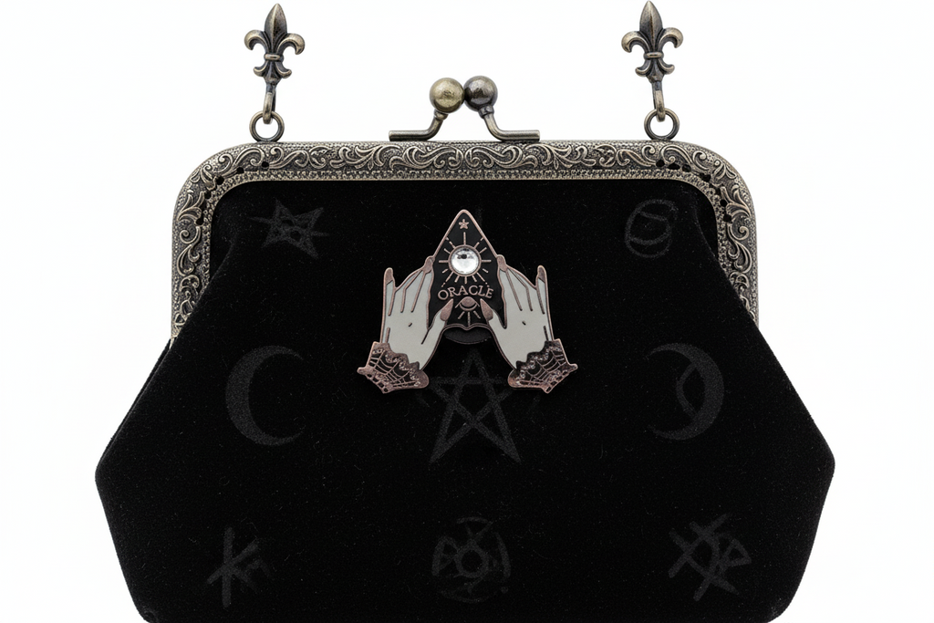 planchette enamel pin attached to purse witchy brooch accessory for bags and personal style