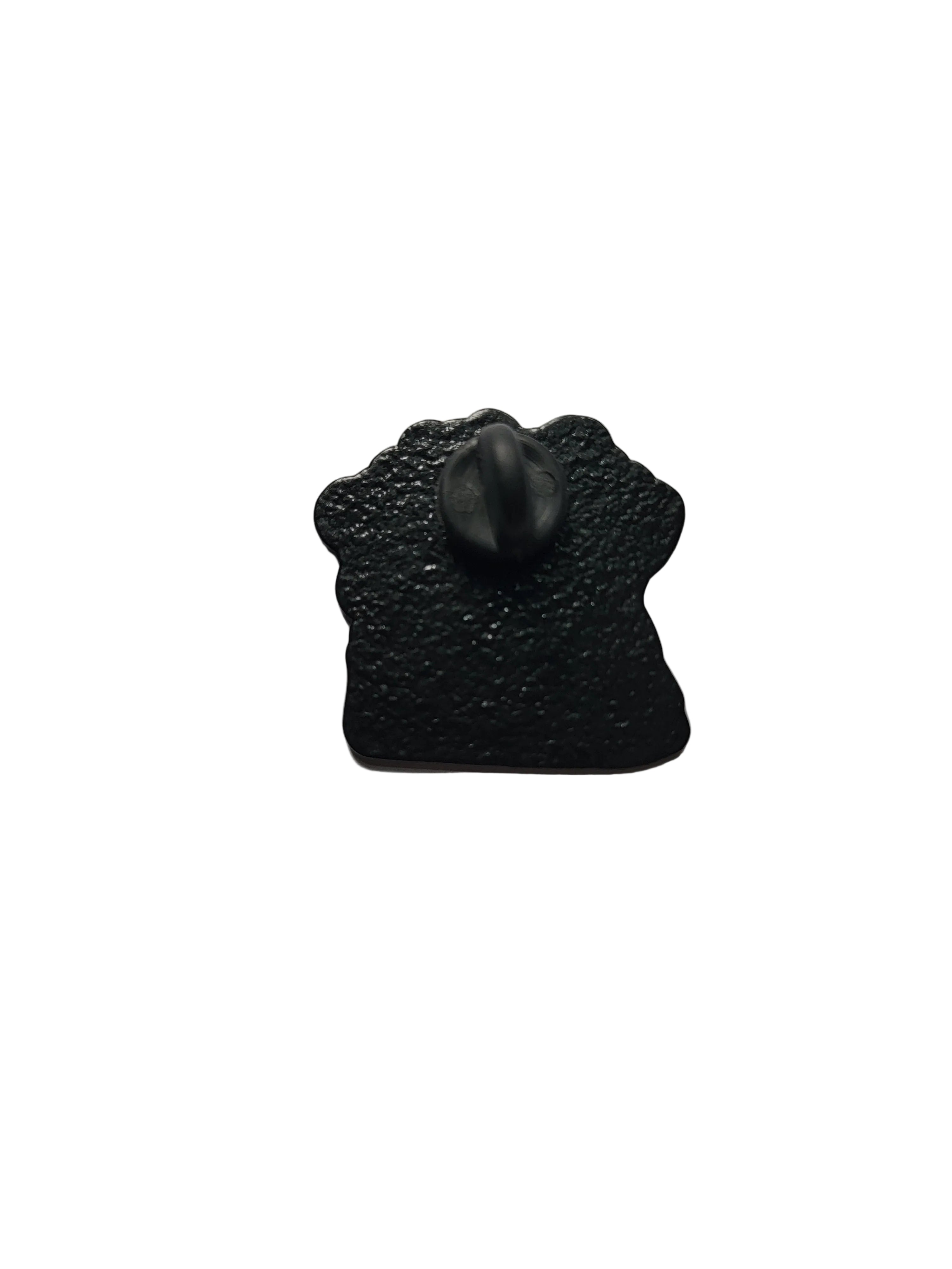 Black textured pin back on a light white background