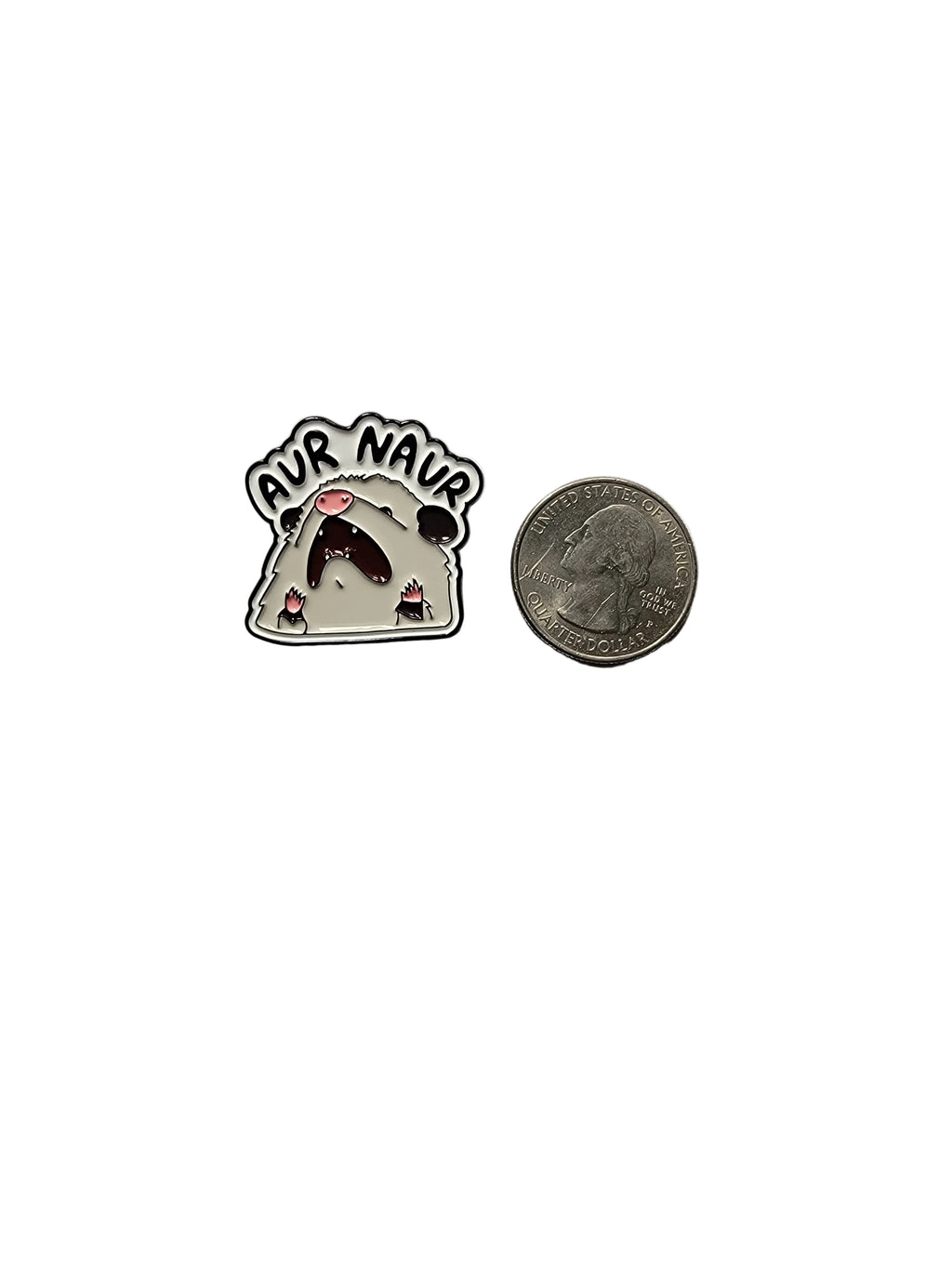 Small round badge with text and a design, next to a quarter for scale, on a white background