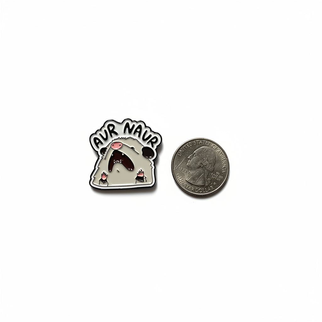 Aur Naur enamel pin shown next to quarter for size reference meme enamel pin dims 1W in x 1H in