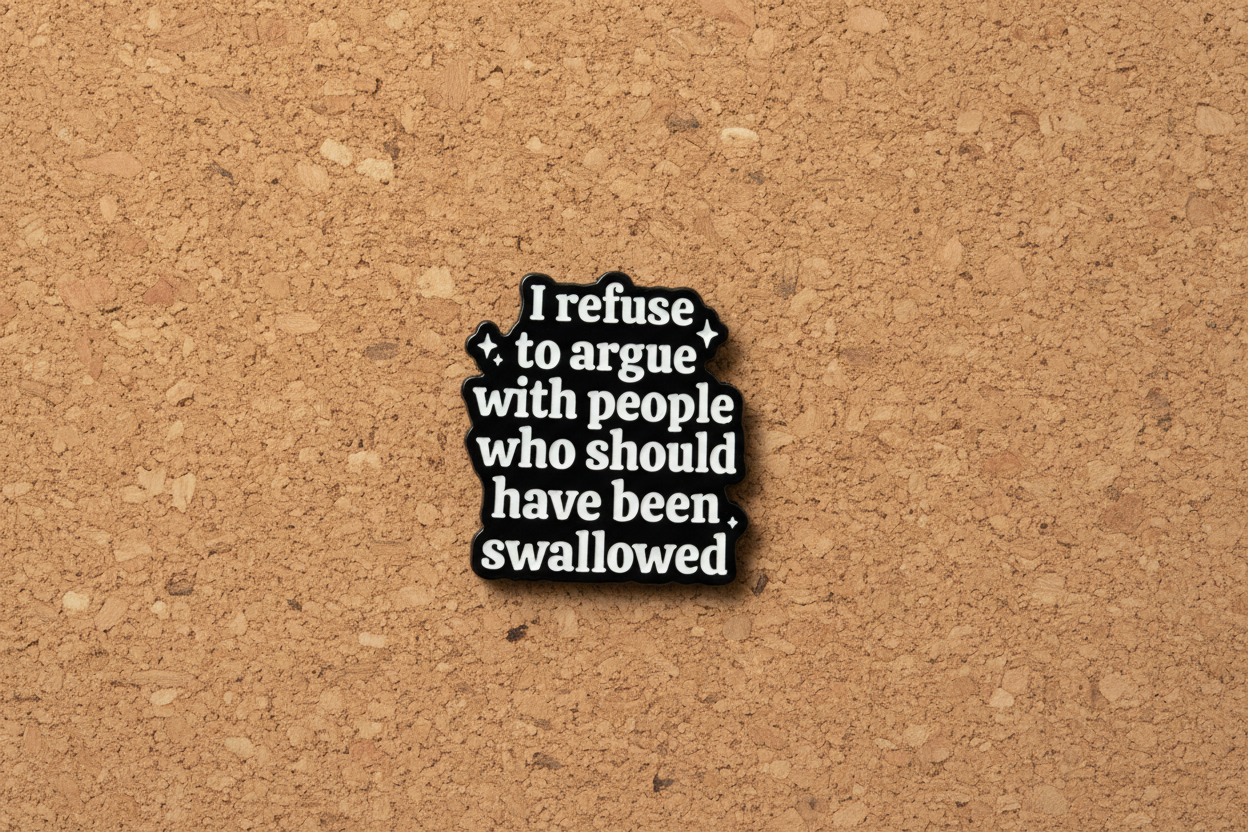 Black and white text pin on a cork background