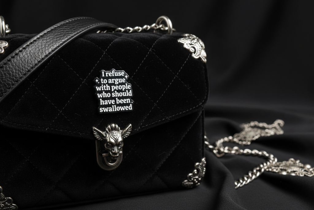 Black and white text pin on a black purse background