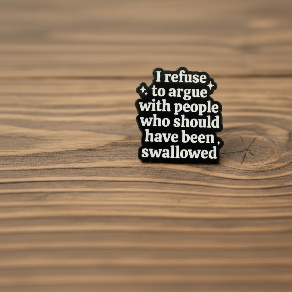 I refuse to argue with people who should have been swallowed enamel pin on wood background adult enamel pin with black and white text detail