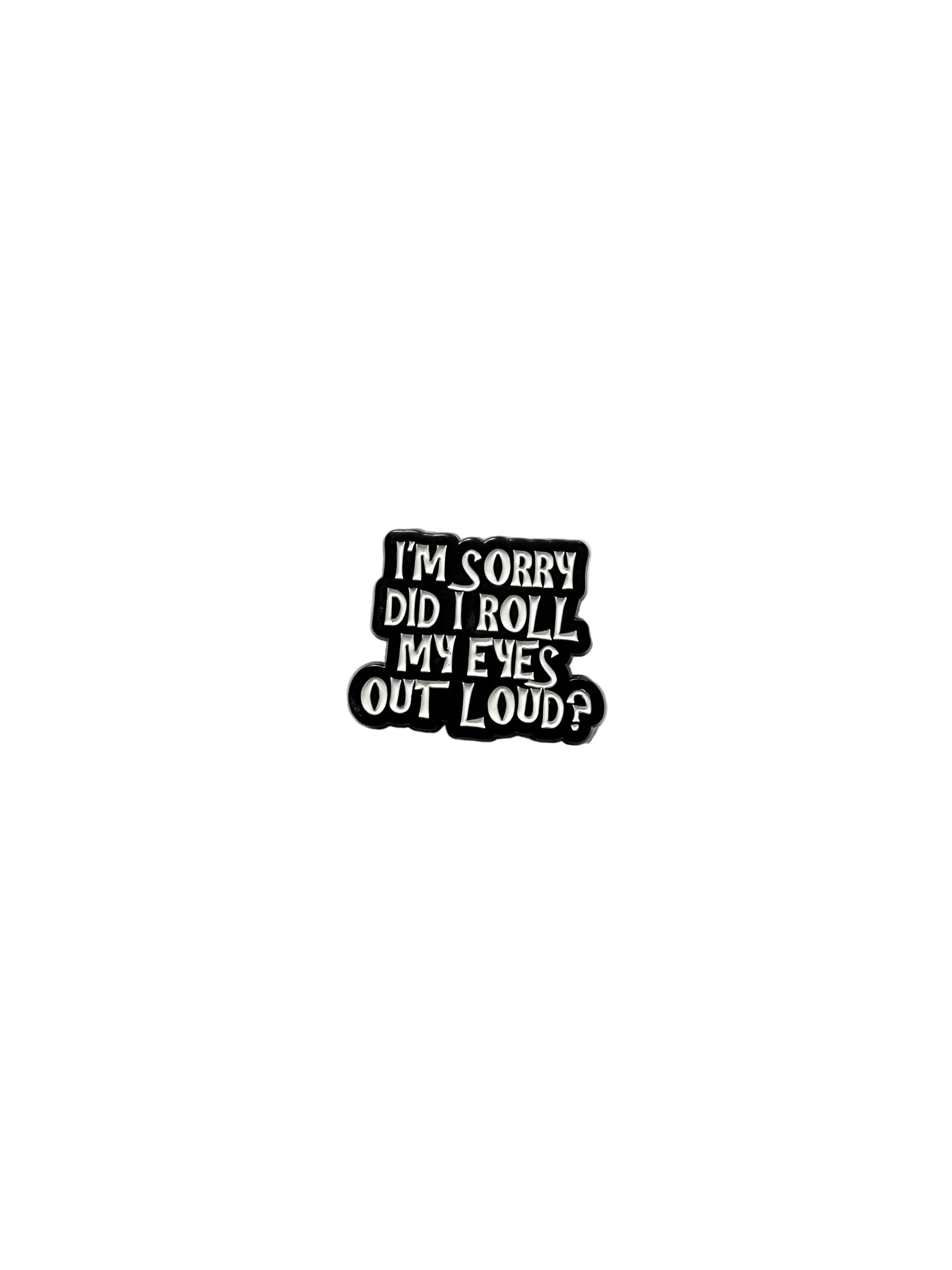Black and white enamel pin with text on a gray background