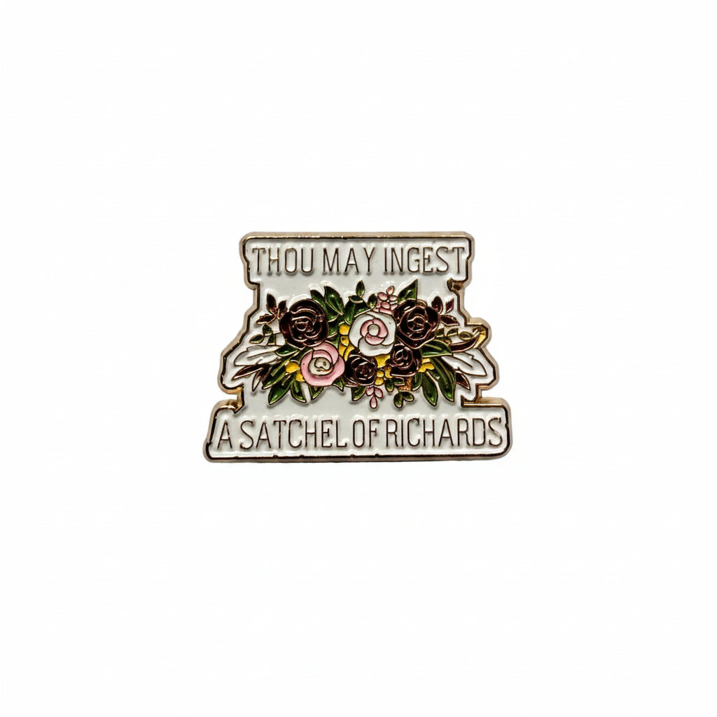a enamel pin with text and a floral design on a white background