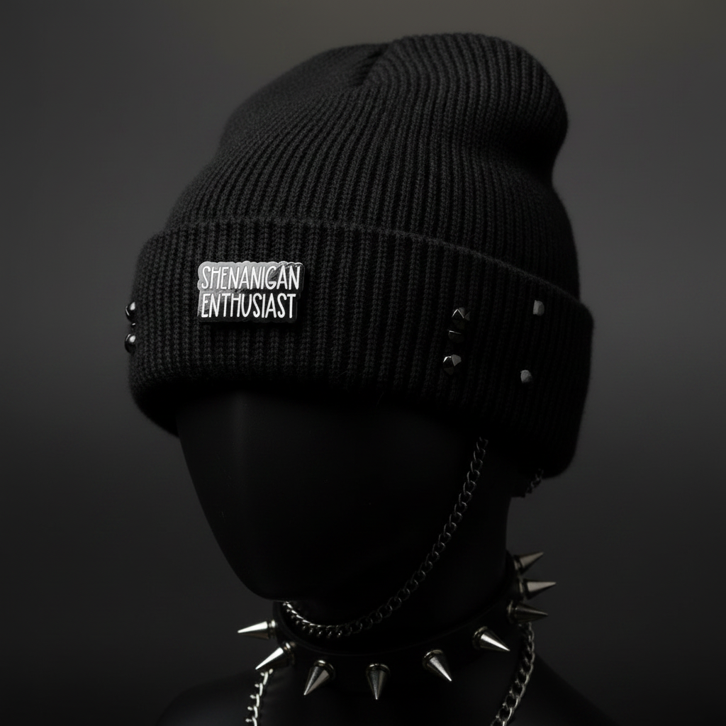 Shenanigan Enthusiast enamel pin worn on beanie hat alternative style enamel pin for casual outfits and street wear