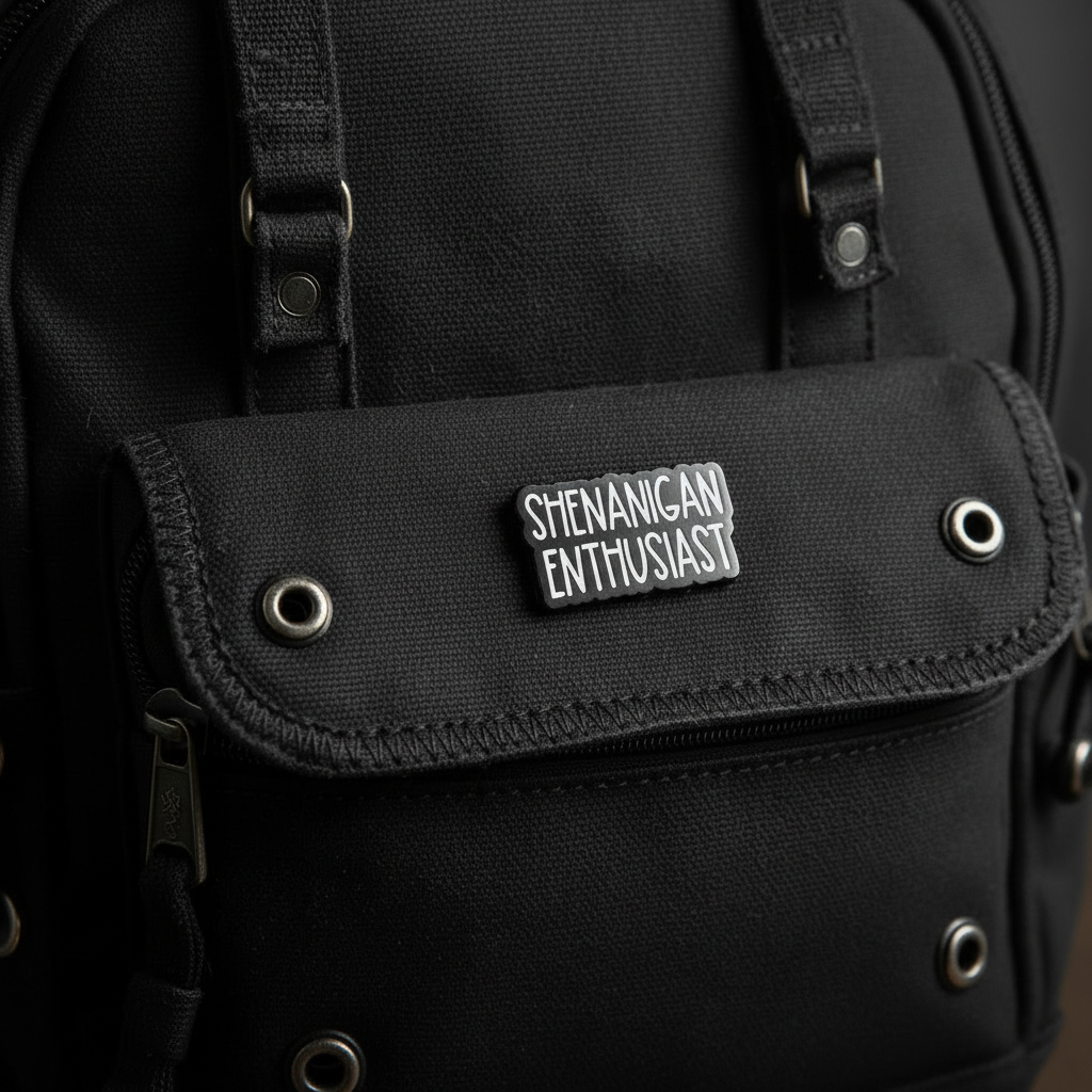 Shenanigan Enthusiast enamel pin on backpack funny accessory for customizing bags and school gear