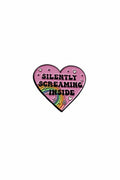 Heart-shaped pink enamel pin with rainbow and text on a gray background