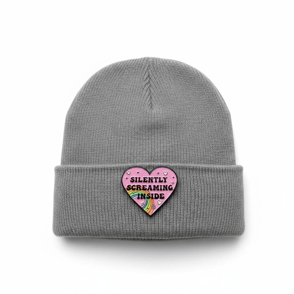 Silently Screaming Inside enamel Pin worn on beanie hat alternative enamel pin for casual outfits and street wear