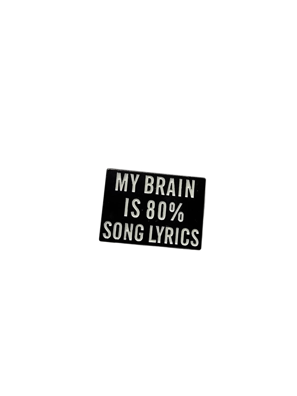 Small black rectangular pin with white text on a light gray background