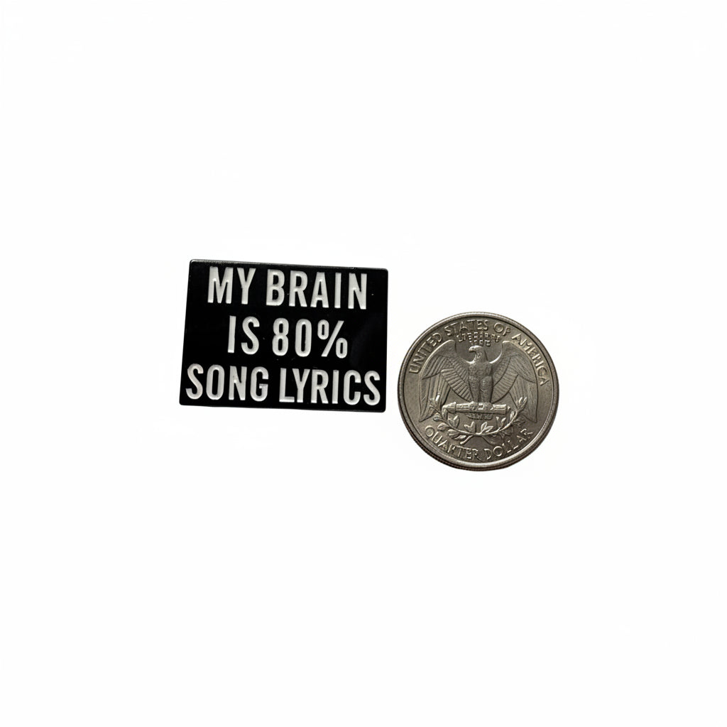 My brain is 80% song lyrics enamel pin shown next to quarter for size reference sarcastic enamel pin dims  1 1/8 in W x 1 in H